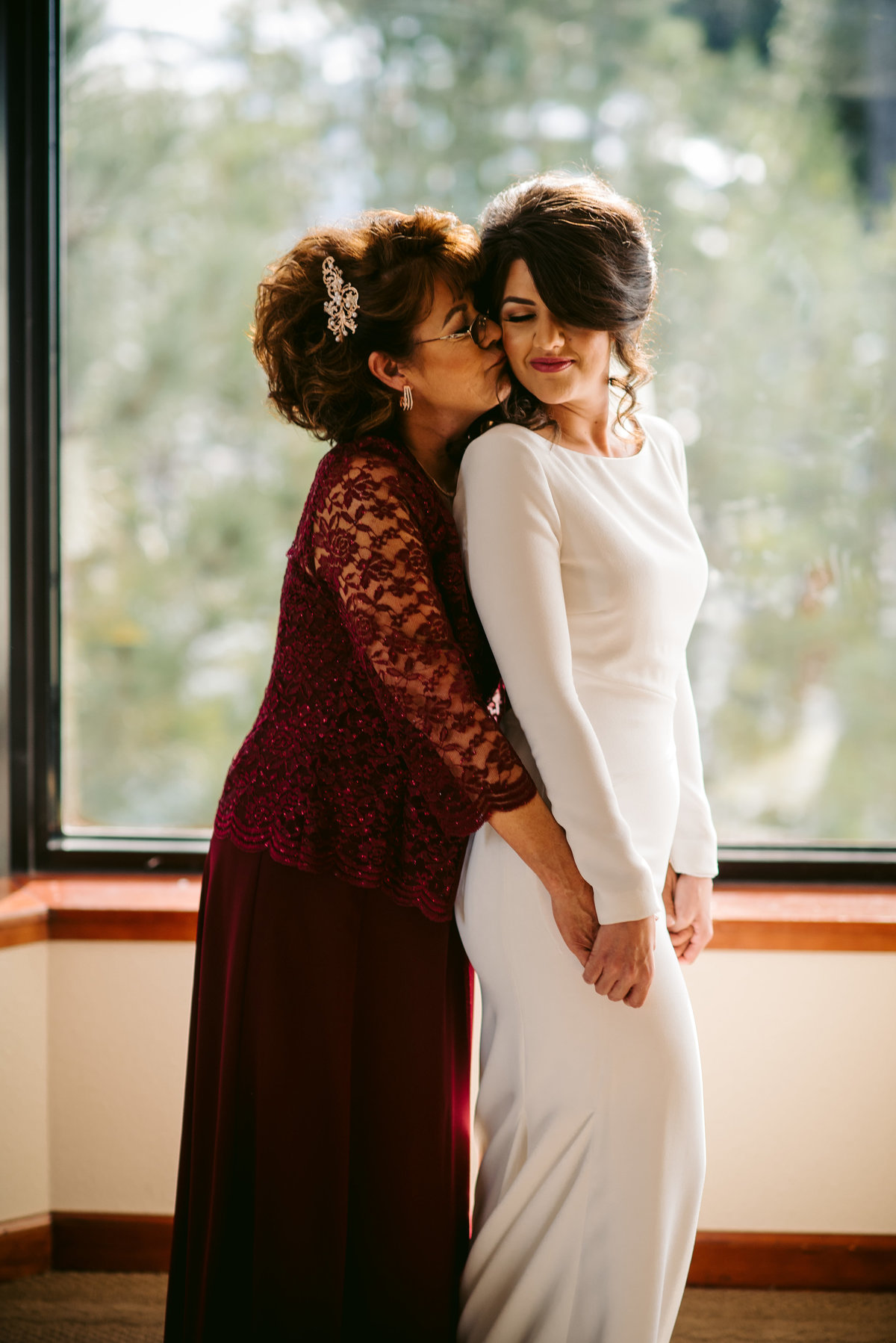 Lake Tahoe Wedding Planners bride and her mothers tender moment before wedding at venue The Resort at Squaw Creek, Lake Tahoe, Joy of Life Events image by Charleston Churchill